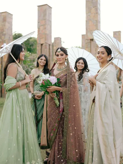 A closer look at Mouli and her bridesmaids. The mix of pastel sarees and lehengas creates a soft and beautiful color palette.