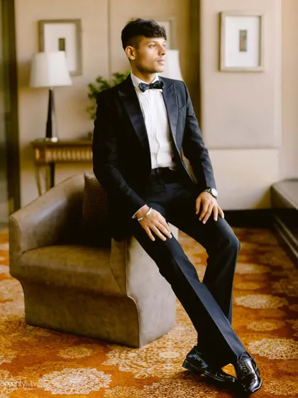 A dapper portrait of the groom in a classic tuxedo, looking sharp and sophisticated for his pre-wedding shoot.