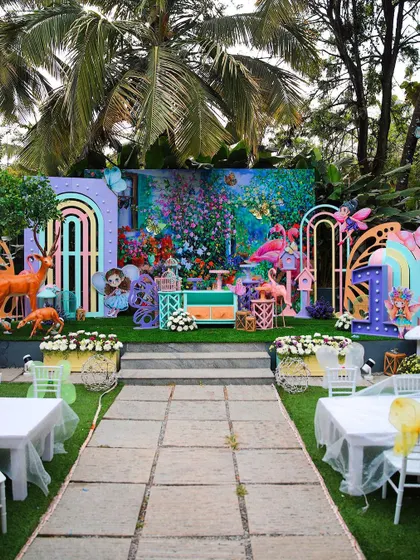 A whimsical and colorful kids' birthday party setup. The enchanted forest theme, complete with fairies, deer, and flamingos, shows the creative possibilities at our venue.
