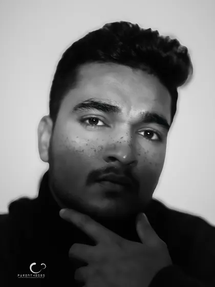 A striking black and white male portrait with a motion blur effect. The image feels raw and full of energy, capturing a fleeting moment of intensity.