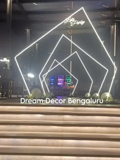 A modern entrance for a party, created with geometric LED frames. This creates a futuristic and exciting walkway for guests as they arrive.