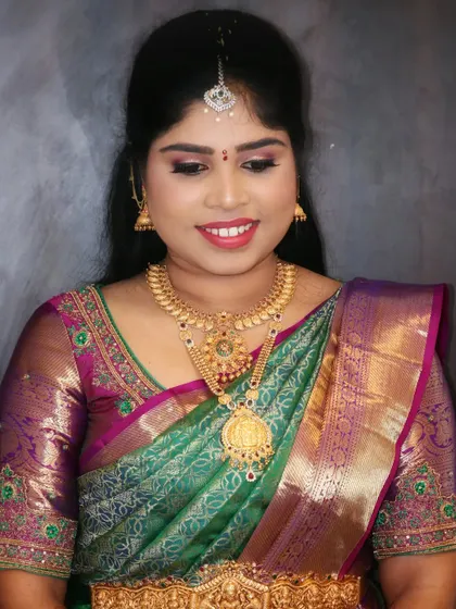 A close up of the HD makeup for Sowmya's engagement. The skin looks flawless and radiant, with a soft shimmer on the eyes and a natural lip color that enhances her features beautifully.