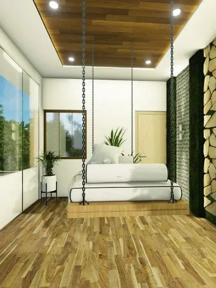 This view shows the floor-to-ceiling glass wall, which floods the balcony room with natural light and offers expansive views.