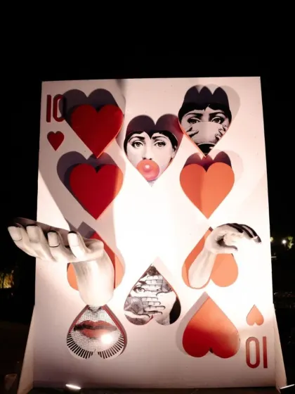 A 3D photo installation based on a 'Queen of Hearts' playing card, incorporating the couple's faces. This interactive and artistic piece was a huge hit with guests.