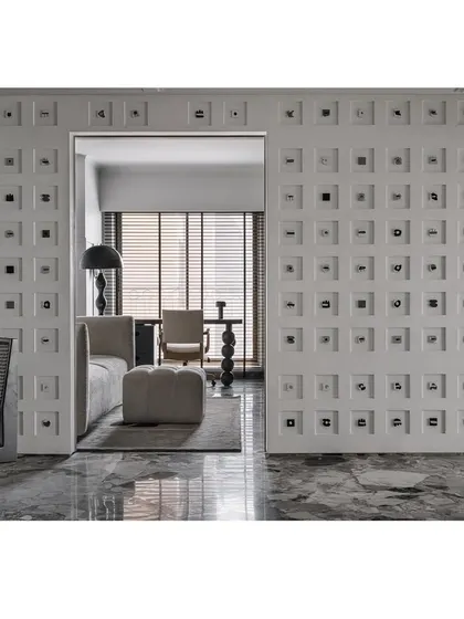 The 'Decode 260' wall at Frenchie Haus is a captivating custom feature that narrates the clients' journey in Morse code. It’s a showstopper that makes the design deeply personal.
