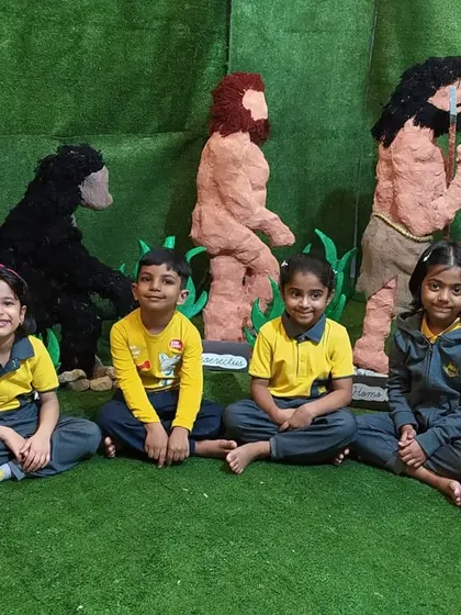 Students sit proudly with their handmade models depicting the evolution of man. We introduce history and anthropology in a simple, visual way that sparks curiosity about our shared past.