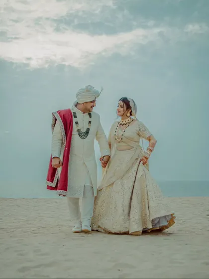 A classic couple portrait on the sands of Goa. We guide our couples into poses that feel natural and romantic, with the beautiful sea and sky as the perfect canvas.