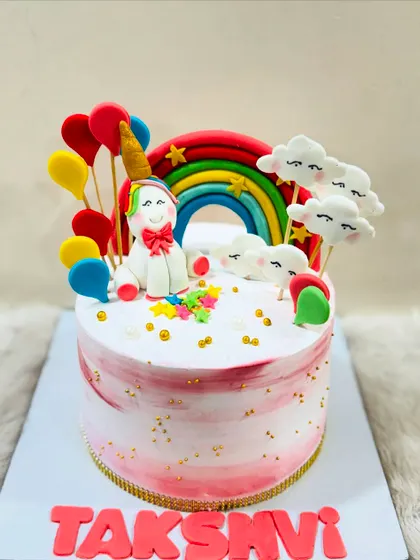 Another take on the magical unicorn theme, this cake features a beautiful unicorn surrounded by a rainbow, fluffy clouds, and colorful balloons.