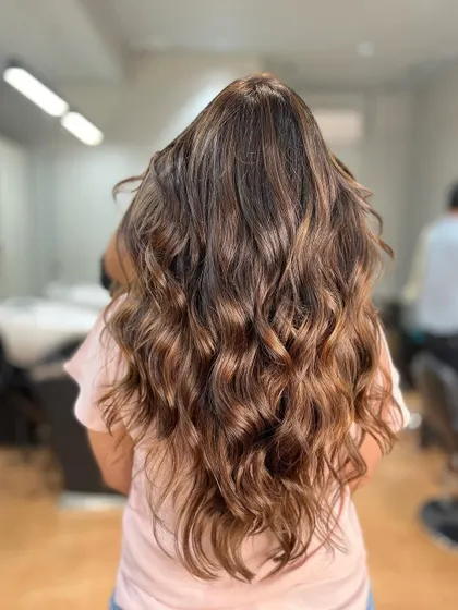 A warm brown balayage, protected with Olaplex to ensure the hair stays strong and healthy throughout the coloring process.