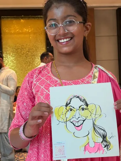 A young guest at a get-together, delighted with her exaggerated portrait. My art is for all ages.