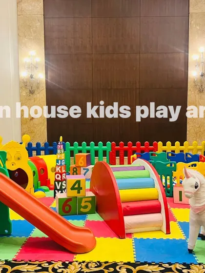A close-up of the colorful slide, numbered blocks, and rocking horse in our rainbow collection.