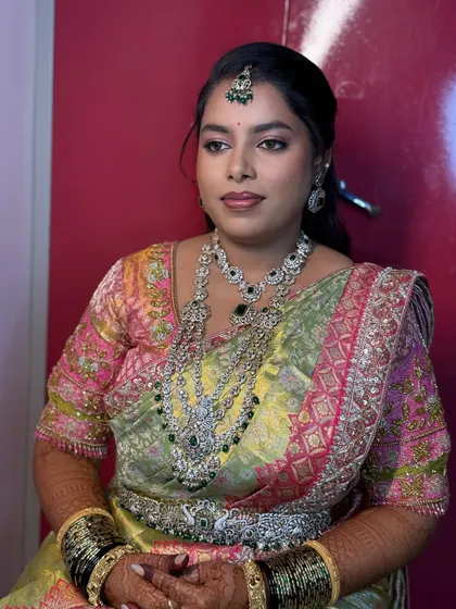 Another angle of Chaitra's elegant reception look. The makeup is kept soft and pretty, allowing her natural beauty to shine.