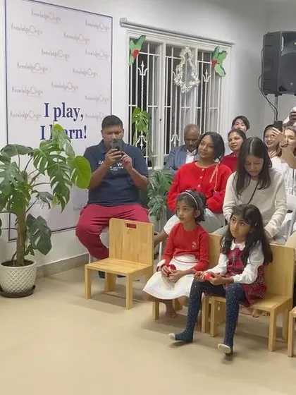 A talented young guest sings for the audience while parents and children watch. Our community events often showcase the diverse talents of our families.