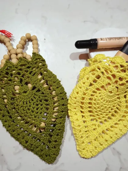 These pouches are so versatile. The olive green one holds a string of prayer beads, while the yellow one is perfect for a concealer stick and foundation.