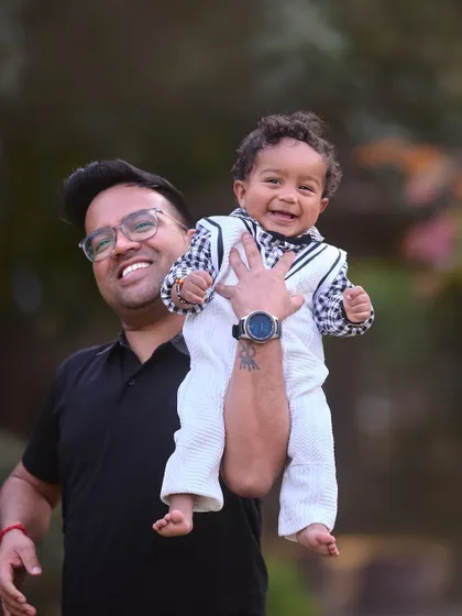 Daddy's little boy, flying high. These playful, interactive shots are a cornerstone of my family sessions, capturing the energy and joy of parenthood.