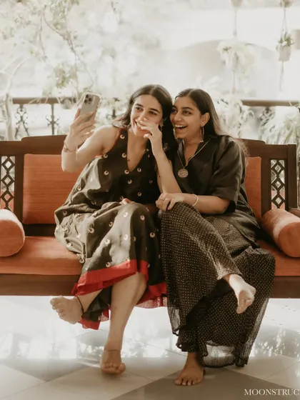 A candid selfie moment from the mehendi, just two friends and co-founders enjoying the process, dressed in our favorite homegrown labels.