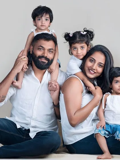 A happy family portrait with three wonderful children. Capturing the energy and individual personalities in a larger family group is always a joyful challenge.