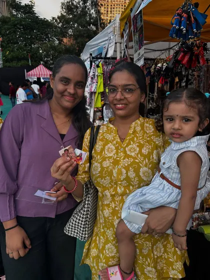 A family posing with their new custom magnets at my exhibition stall. It's always a pleasure to capture these moments.