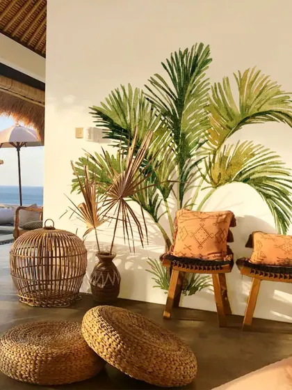 This cozy seating area is transformed into a tropical escape with our Palm Tree wall stickers. The design complements the natural elements and creates a relaxed and inviting vibe.