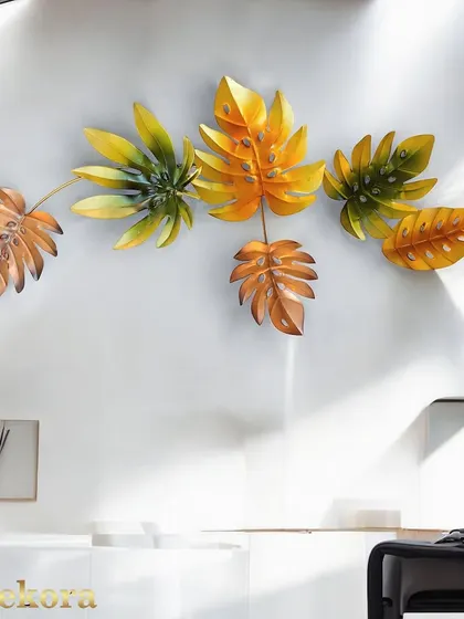 The autumn leaf wall decor adds a warm and rustic touch to this modern, bright space.