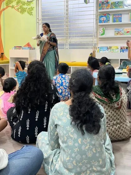 A storyteller using a hand puppet to engage the audience during our launch festival. We use various techniques to make our events interactive and fun for all ages.
