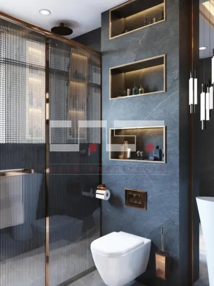 A bold and dramatic bathroom render with dark grey stone walls, a freestanding sink, and reeded glass partitions with rose gold frames.