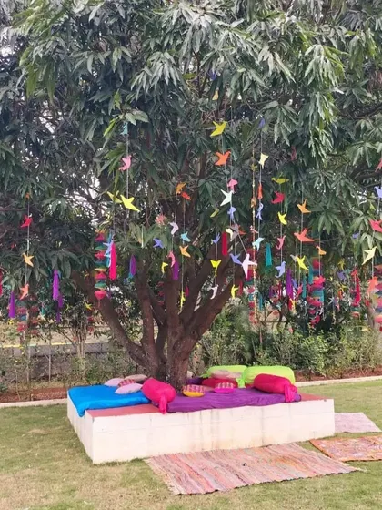 Another angle of the colorful under-the-tree seating, perfect for a casual and fun Mehendi party.