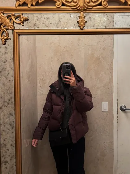 A faceless mirror selfie showing off my winter OOTD.