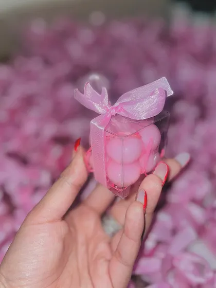 Our mini bubble candles are perfect for baby shower favors. This large order of pink candles is ready for packaging.