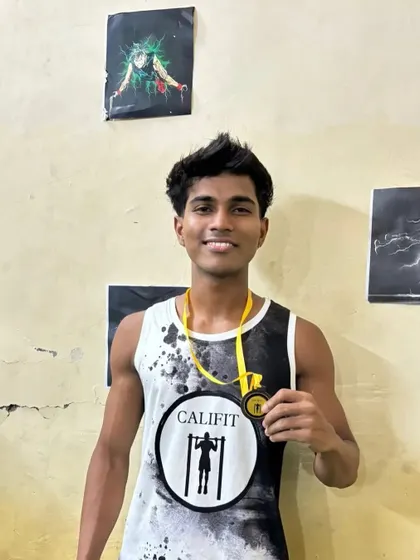 Another one of our proud athletes after a successful competition. His smile says it all.