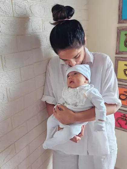 A tender moment with my baby. The chakra art on the wall is a constant reminder of the energy work that is so central to my practice and life.