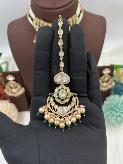 A showcase of our various maang tikkas, designed to match our premium Kundan and Moissanite necklace sets. These accessories complete the bridal look and are a key part of our wholesale sets.