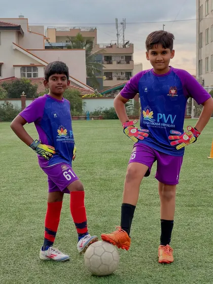 Arjun and Vismay, our U-9 and U-11 goalkeepers, showing the confidence and camaraderie we build among our players.