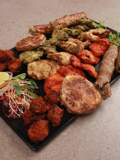 Another view of our grand non veg platter, showcasing the rich colours and textures of our different kebabs. It is a celebration of flavours, perfect for sharing with friends and family.