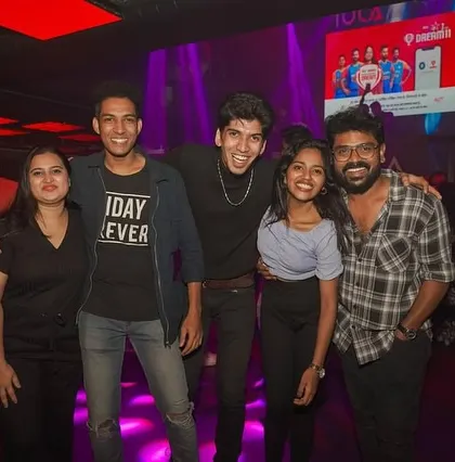 A group of friends enjoying the vibrant atmosphere and great music.