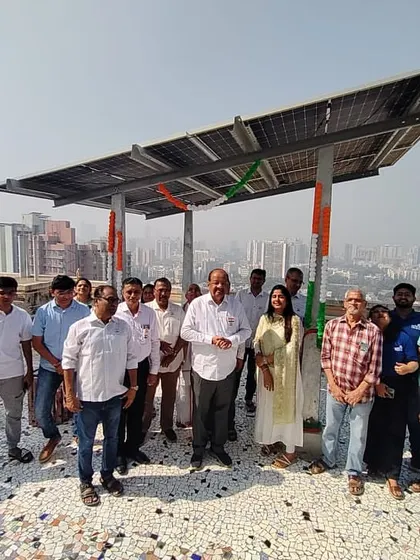 Residents of Kesley housing society on their rooftop, celebrating freedom from electricity bills with their new 40 kW solar system.