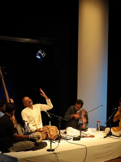 A wide shot of T.M. Krishna and his ensemble on our stage, creating an intimate and immersive musical experience for the audience.