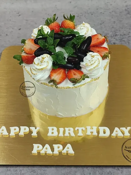 A simple and delicious vanilla chocolate fruit cake. Topped with fresh strawberries and grapes, it's a lighter option for those who love the taste of fresh fruit.