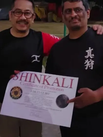 Me receiving my own certificate of promotion from Sensei E. The learning never stops.