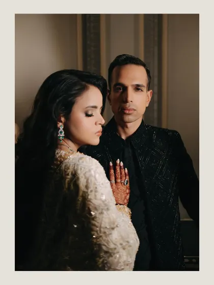 An elegant and formal couple portrait. The sophisticated styling and direct gaze create a powerful and timeless image of partnership.