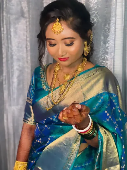 A close-up of Priyanka's reception makeup, showing the beautiful contrast between her red lips and blue saree.