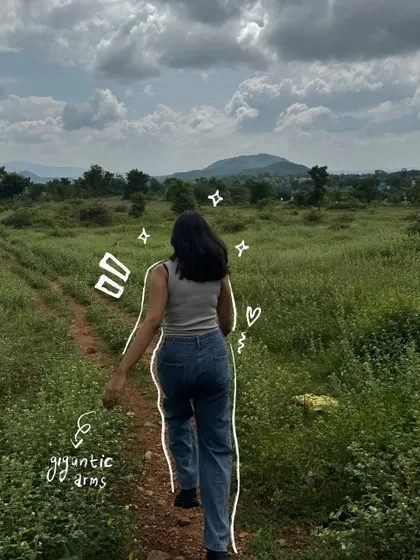Walking through a field, with a simple outline and text to point out my "gigantic arms" in a funny, self-aware way.