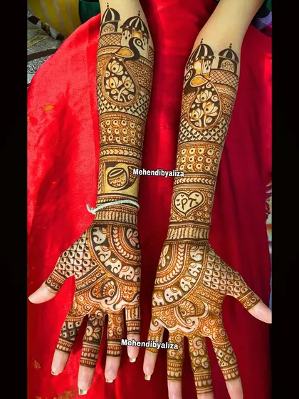 A beautiful bridal design featuring peacocks, lotuses, and a heart with the couple's initials. It's a perfect blend of tradition and personalization.