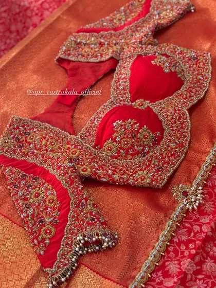 The front of the red bridal blouse, with padded cups and a sweetheart neckline.