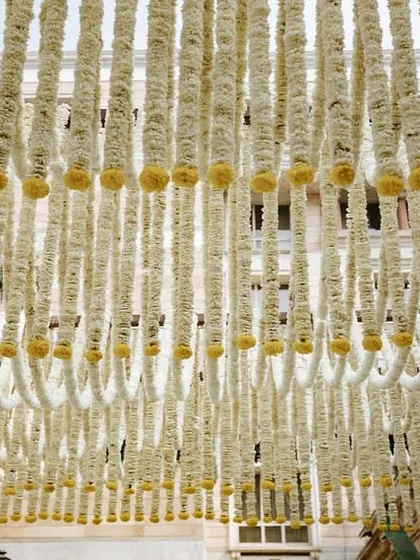 A look at the ceiling, made from thousands of hand-strung jasmine flowers creating a beautiful scalloped pattern.