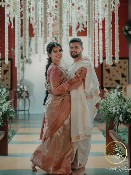 A beautiful portrait of the couple in their traditional wedding attire.