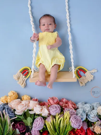 A full view of the floral swing setup, showing the creative and dreamy scenes I can build for your newborn's photoshoot.