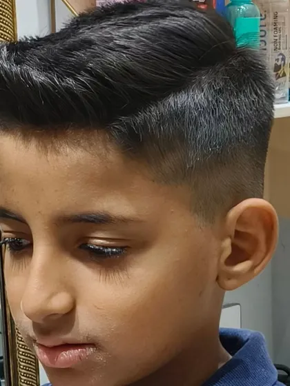 Another angle of this cool kid's cut, showing the volume and texture on top.