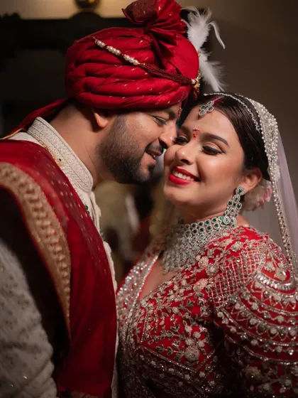 A romantic close-up of a bride and groom, their faces close, capturing the intimacy and happiness of their wedding day.