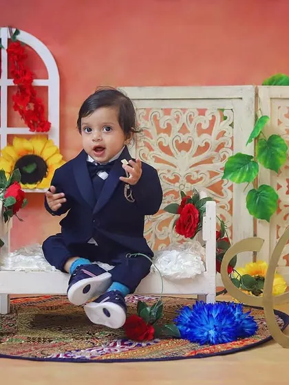 This handsome little man is looking dapper in his suit for a special collaboration photoshoot.